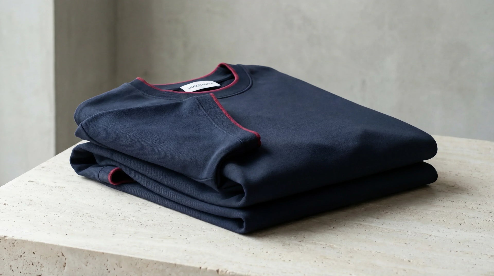 SM Sunwash T-shirt folded on concrete table