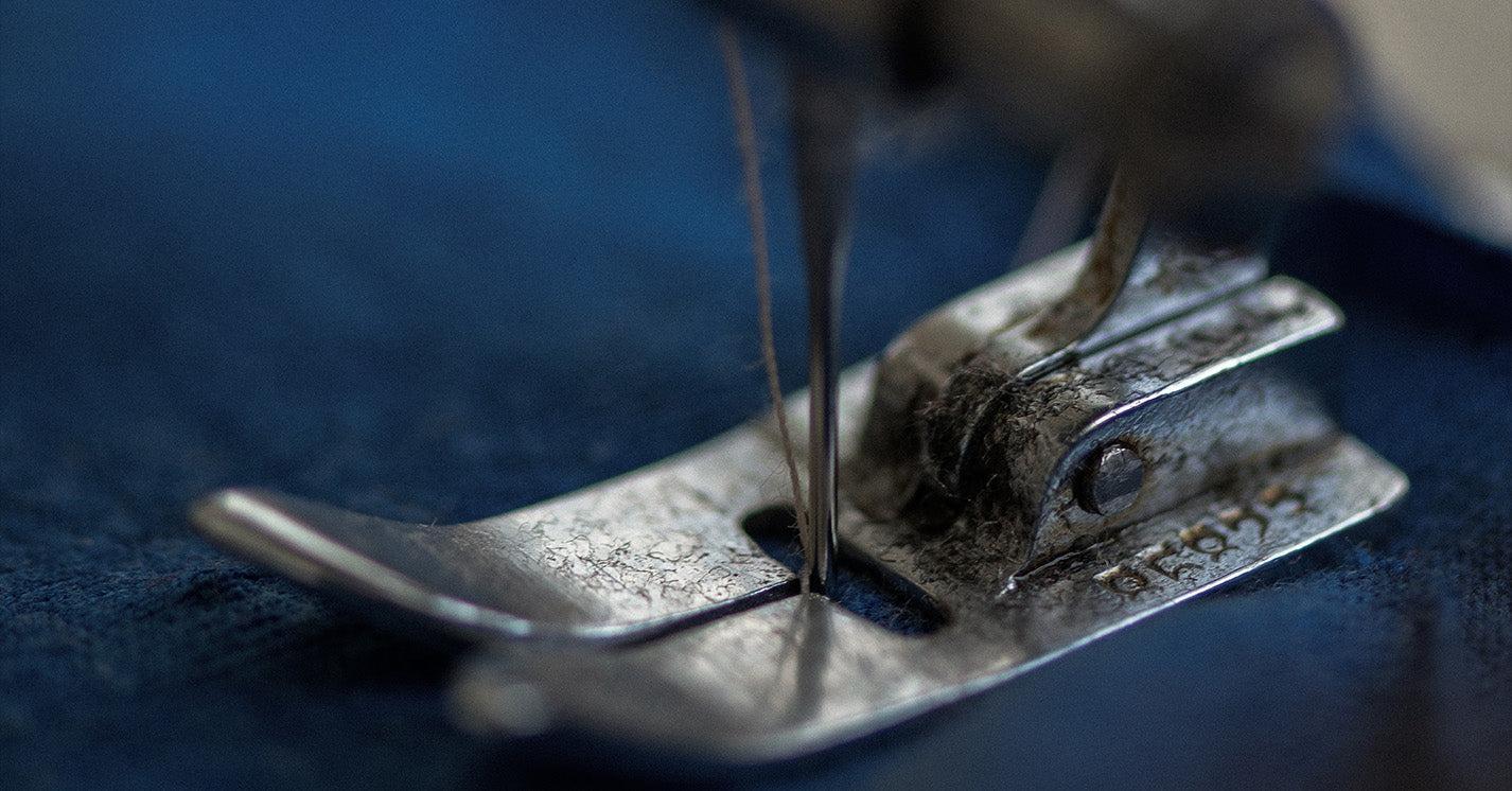 Machine sewing fabric.