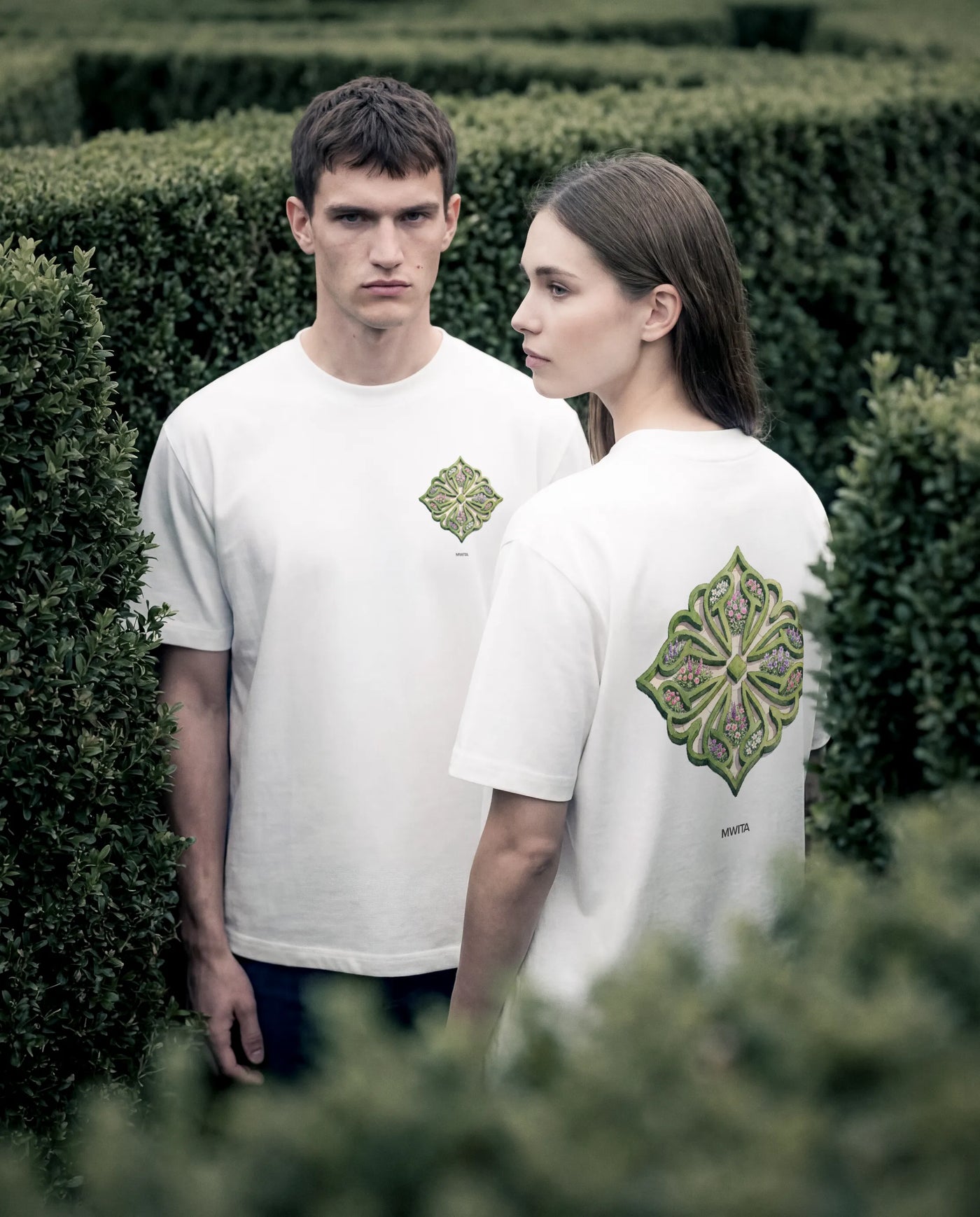 Close up of two models wearing the SM Verdant T-shirt and Heritage Straight Leg Denim Jeans