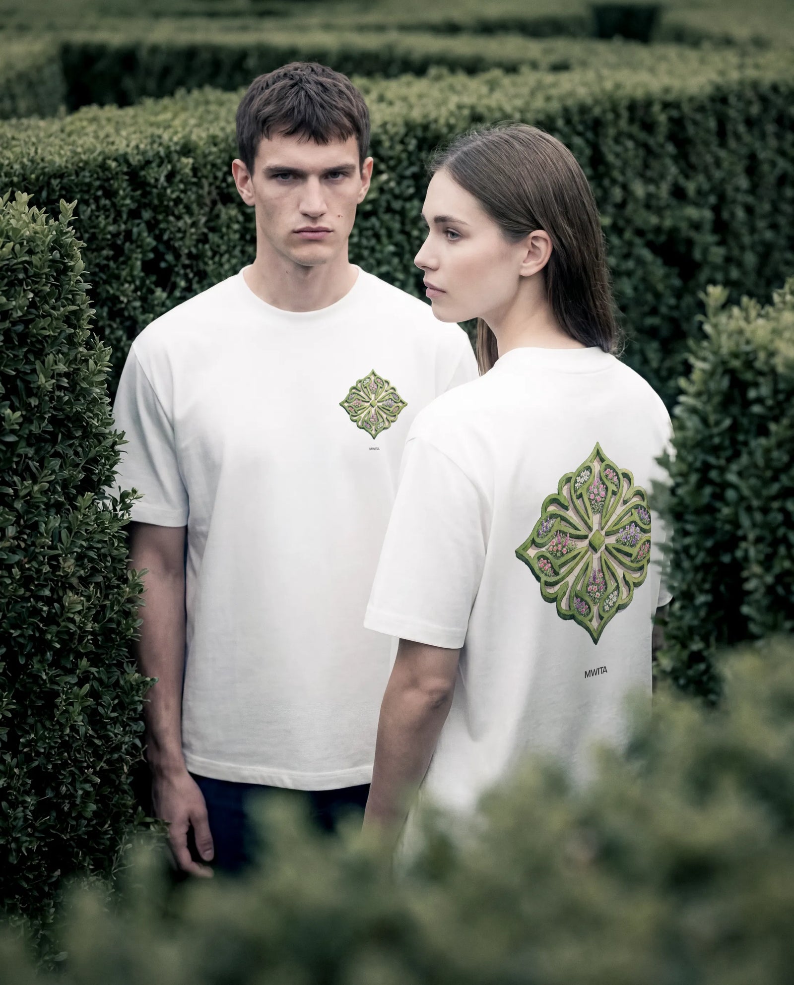Close up of two models wearing the SM Verdant T-shirt and Heritage Straight Leg Denim Jeans