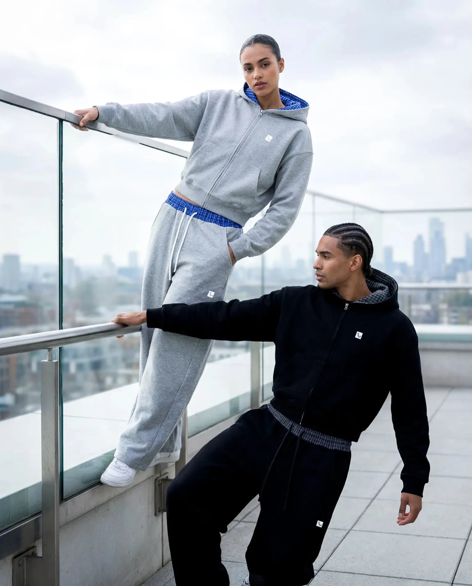 Two models wearing Plaid Hoodies and Sweatpants