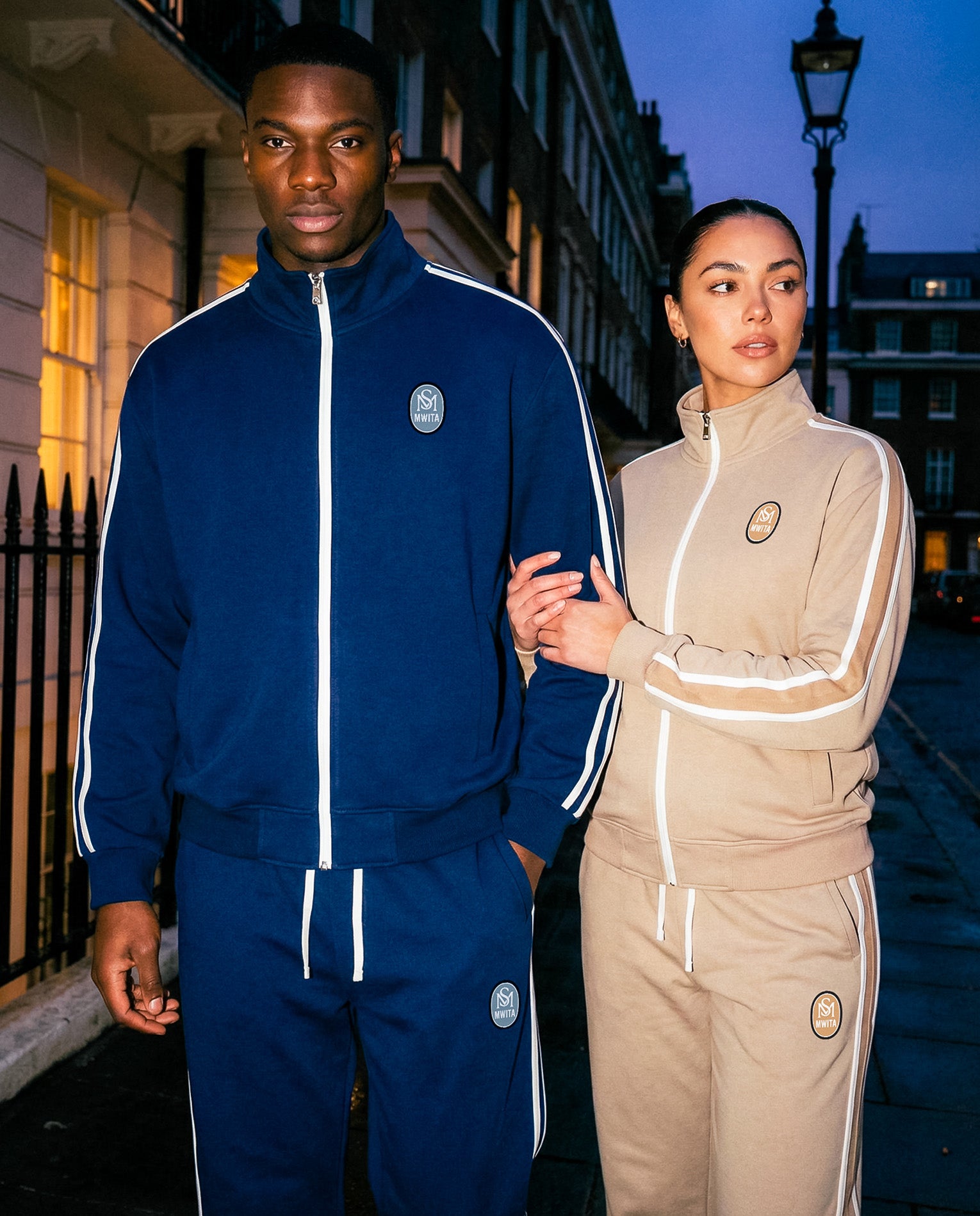 Two models wearing the Insignia track set two-piece.