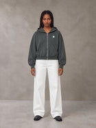 Model wearing SM Sig. Full-Zip Boxy Hoodie in Deep Charcoal, front view.