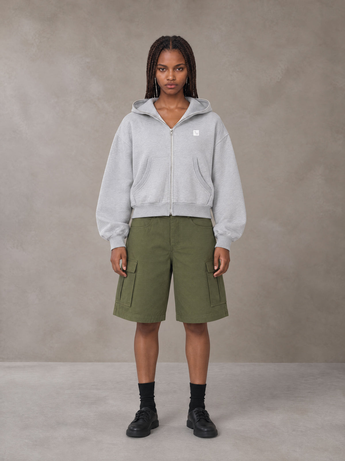 Model wearing SM Sig. Full-Zip Boxy Hoodie in Floral Grey, front view.