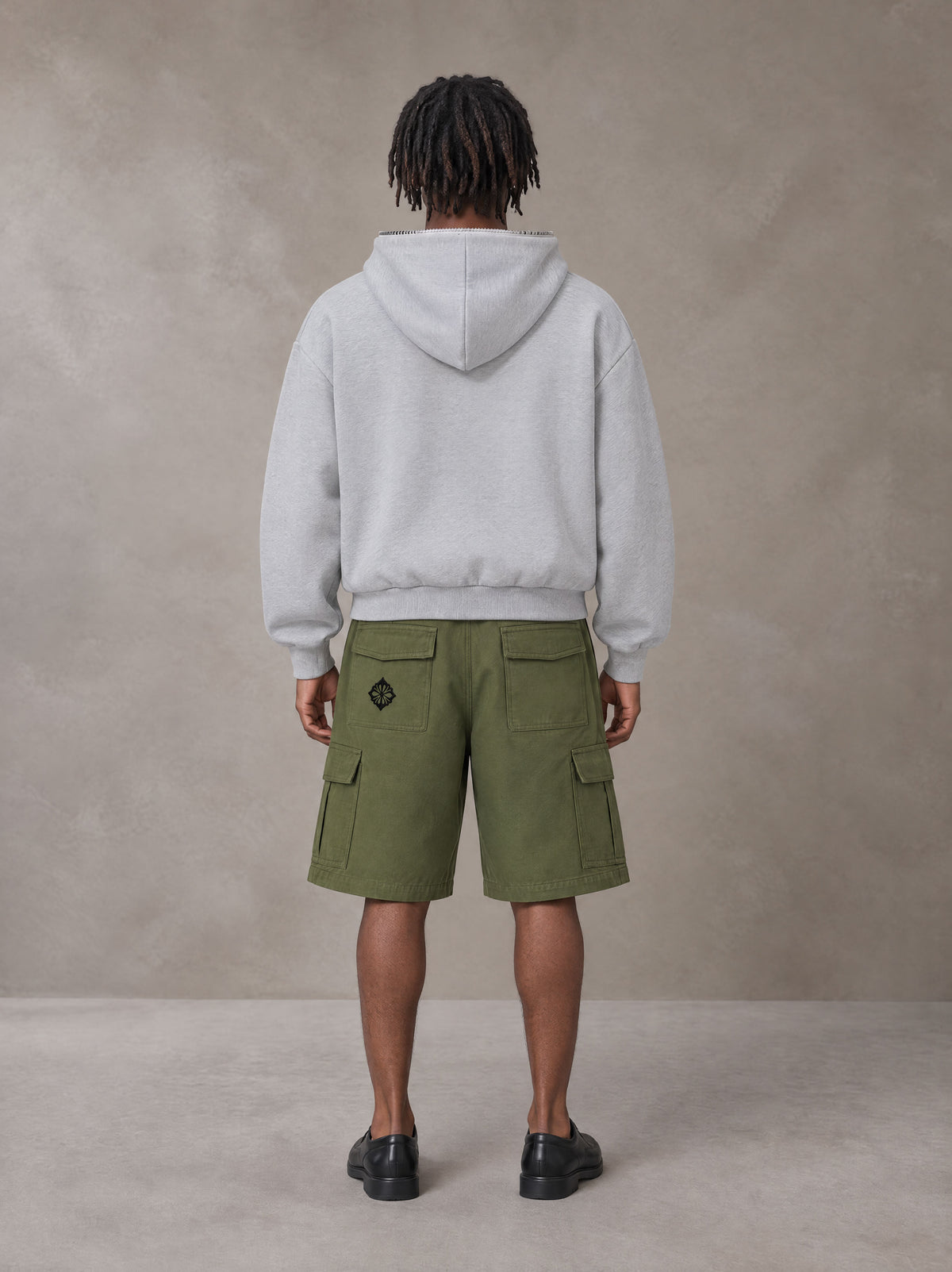 Model wearing SM Sig. Full-Zip Boxy Hoodie in Floral Grey, rear view.
