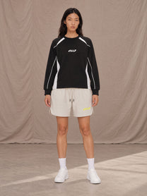 Model wearing SM Motion Sweatshirt in Midnight Black, front view.