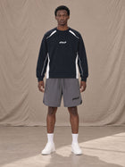 Model wearing SM Motion Sweatshirt in Oxford Navy, front view.