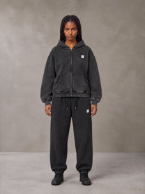 Model wearing the SM Sig. Boxy Hoodie with SM Sig. Jogger Sweatpants in Midnight Black, front view.