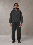Model wearing the SM Sig. Boxy Hoodie with SM Sig. Jogger Sweatpants in Midnight Black, front view.