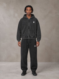 Model wearing the SM Sig. Boxy Hoodie with SM Sig. Jogger Sweatpants in Midnight Black, front view.