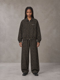 Model wearing the SM Meridian Jacket and SM Meridian Trousers in Loden, front view.