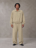 Model wearing the SM Meridian Jacket and SM Meridian Trousers in Ecru, front view.
