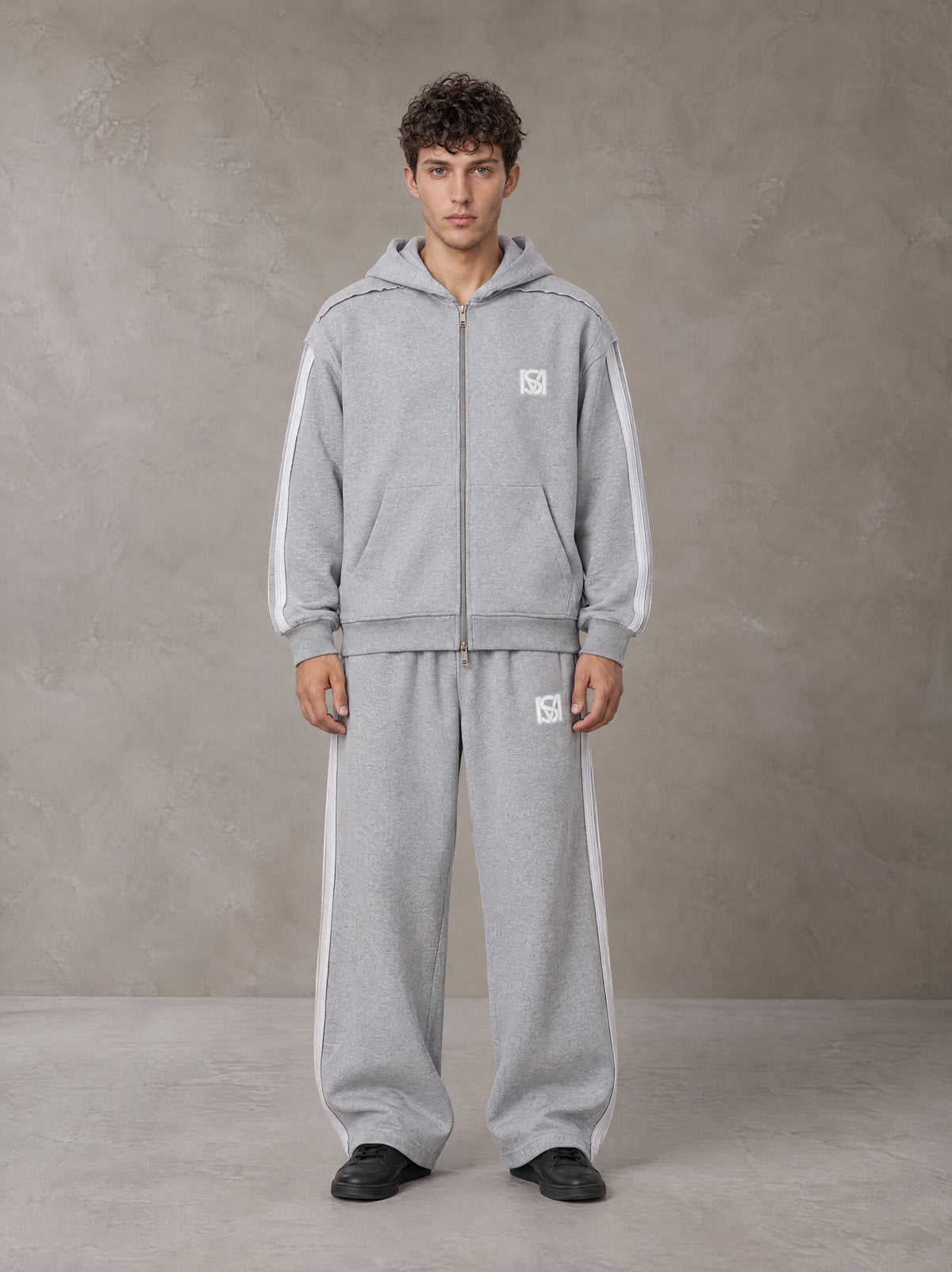 Model wearing the SM Contour Line Zip Hoodie and SM Contour Line Sweatpants in Floral Grey, front view.