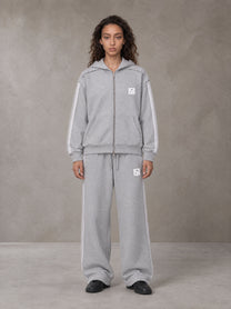 Model wearing the SM Contour Line Zip Hoodie and SM Contour Line Sweatpants in Floral Grey, front view.