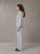 Model wearing the SM Contour Line Zip Hoodie and SM Contour Line Sweatpants in Floral Grey, side profile.