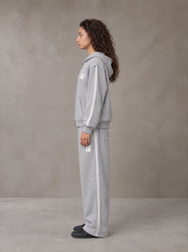 Model wearing the SM Contour Line Zip Hoodie and SM Contour Line Sweatpants in Floral Grey, side profile.