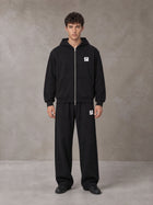 Model wearing the SM Contour Line Zip Hoodie and SM Contour Line Sweatpants in Midnight Black, front view.