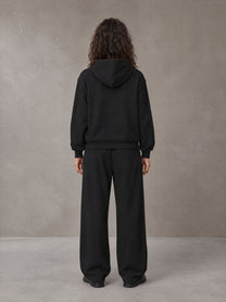 Model wearing the SM Contour Line Zip Hoodie and SM Contour Line Sweatpants in Midnight Black, rear view.