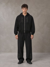 Model wearing the SM Shadow Pulse Hoodie and SM Shadow Pulse Sweatpants in Midnight Black, front view.