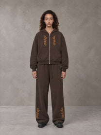 Model wearing the SM Shadow Pulse Hoodie and SM Shadow Pulse Sweatpants in Kabul Brown, front view.