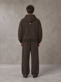 Model wearing the SM Shadow Pulse Hoodie and SM Shadow Pulse Sweatpants in Kabul Brown, rear view.