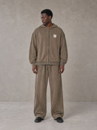 Model wearing the SM Arc Hoodie and SM Arc Sweatpants in Deep Coffee, front view.