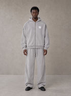 Model wearing the SM Arc Hoodie and SM Arc Sweatpants in Floral Grey, front view.