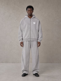 Model wearing the SM Arc Hoodie and SM Arc Sweatpants in Floral Grey, front view.