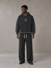 Model wearing the SM Grid Fleur Hoodie and SM Grid Fleur Sweatpants in Deep Charcoal, front view.