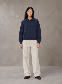Model wearing SM Sig. Fleece Polo Sweatshirt in Oxford Navy, front view.