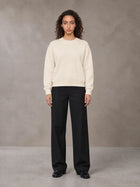 Model wearing SM Straight Leg Trousers in Midnight Black, front view.