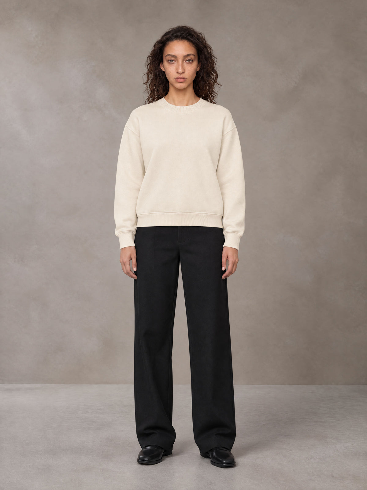 Model wearing SM Straight Leg Trousers in Midnight Black, front view.