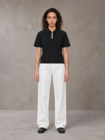 Model wearing SM Straight Leg Trousers in Lucent White, front view.