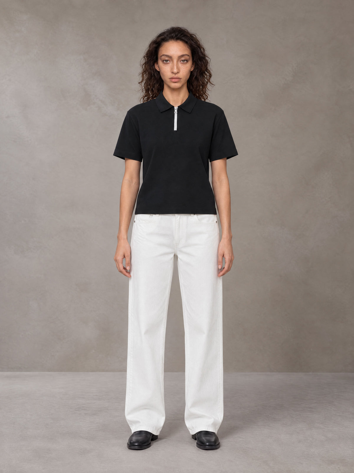 Model wearing SM Straight Leg Trousers in Lucent White, front view.