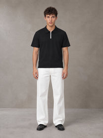 Model wearing SM Straight Leg Trousers in Lucent White, front view.