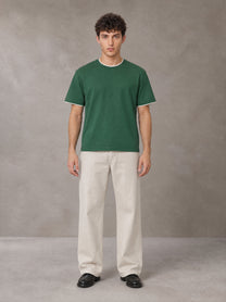 Model wearing SM Straight Leg Trousers in Oat Grey, front view.