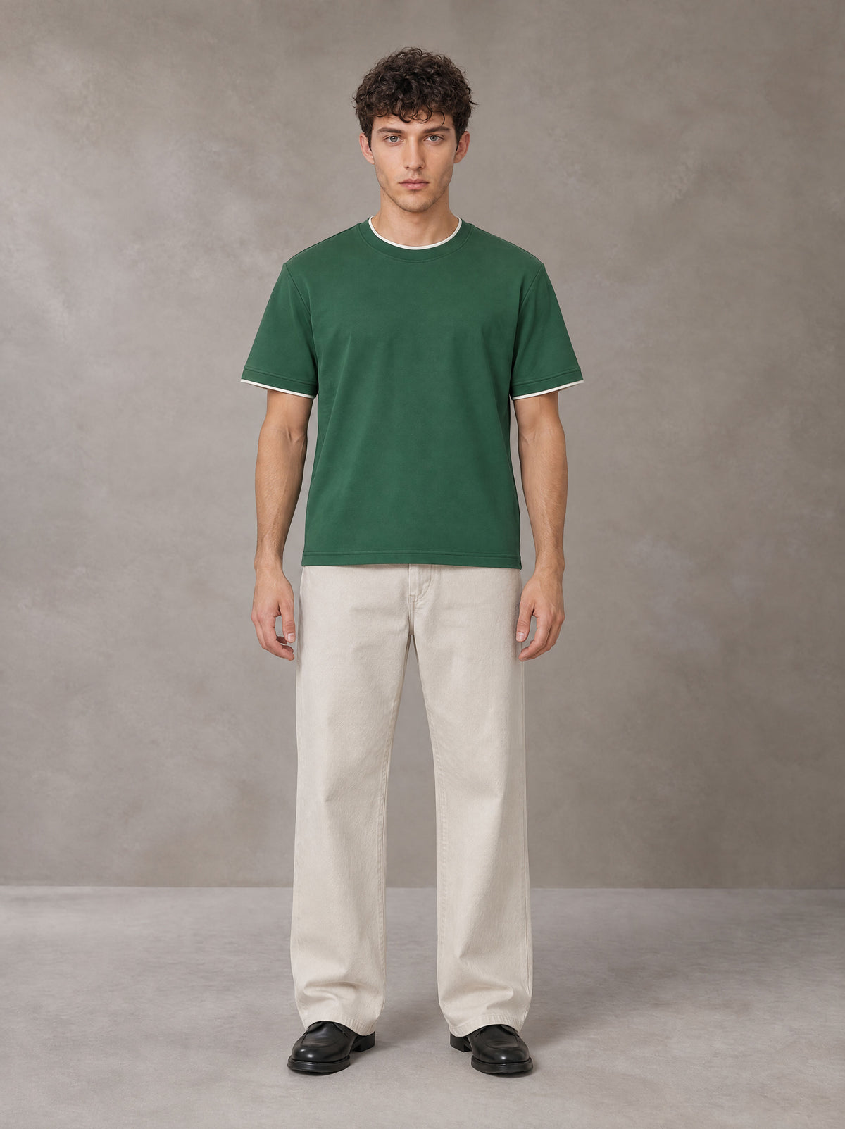 Model wearing SM Straight Leg Trousers in Oat Grey, front view.