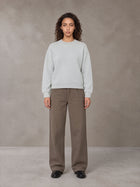 Model wearing SM Straight Leg Trousers in Kabul Brown, front view.