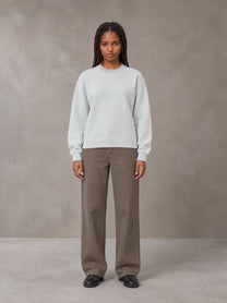 Model wearing SM Sig. Knitted Round Neck Sweatshirt in Solitude, front view.