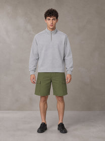 Model wearing SM Sig. Half-Zip Fleece Sweatshirt in Floral Grey, front view.