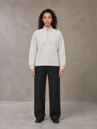 Model wearing SM Sig. Half-Zip Fleece Sweatshirt in Oat Grey, front view.