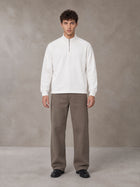 Model wearing SM Sig. Half-Zip Fleece Sweatshirt in Lucent White, front view.