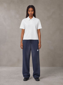 Model wearing SM Sig. Sun Fade Sweatpants in Oxford Navy, front view.