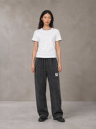 Model wearing SM Snow Fade Sweatpants in Midnight Black, front view.