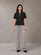 Model wearing SM Snow Fade Sweatpants in Floral Grey, front view.