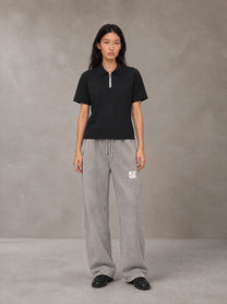 Model wearing SM Snow Fade Sweatpants in Floral Grey, front view.