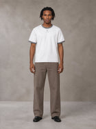 Model wearing SM Sig. Contrast Stitch T-shirt in Lucent White, front view.