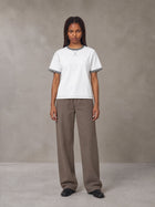 Model wearing SM Sig. Contrast Stitch T-shirt in Lucent White, front view.