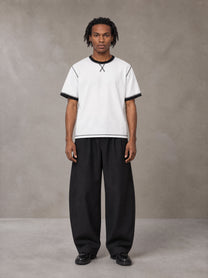 Model wearing SM Sig. Contrast Stitch T-shirt in Lucent White, front view.