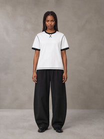 Model wearing SM Sig. Contrast Stitch T-shirt in Lucent White, front view.